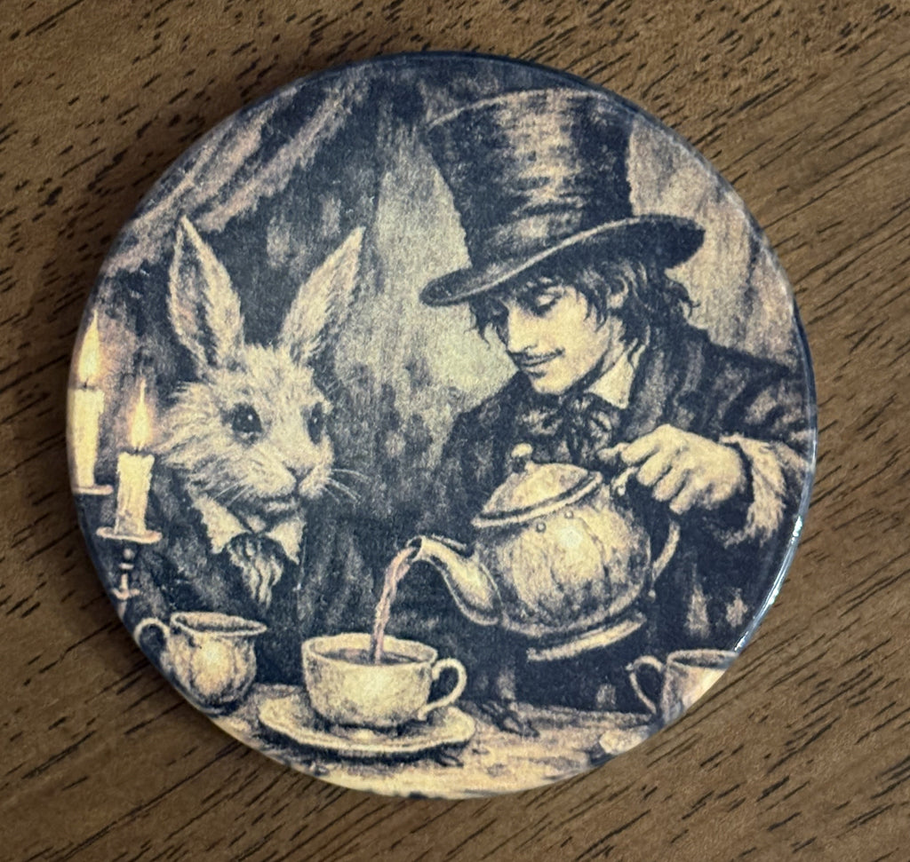 A round coaster featuring a vintage-style illustration of the Mad Tea Party, showing Alice in Wonderland characters pouring tea, displayed on a wooden surface.