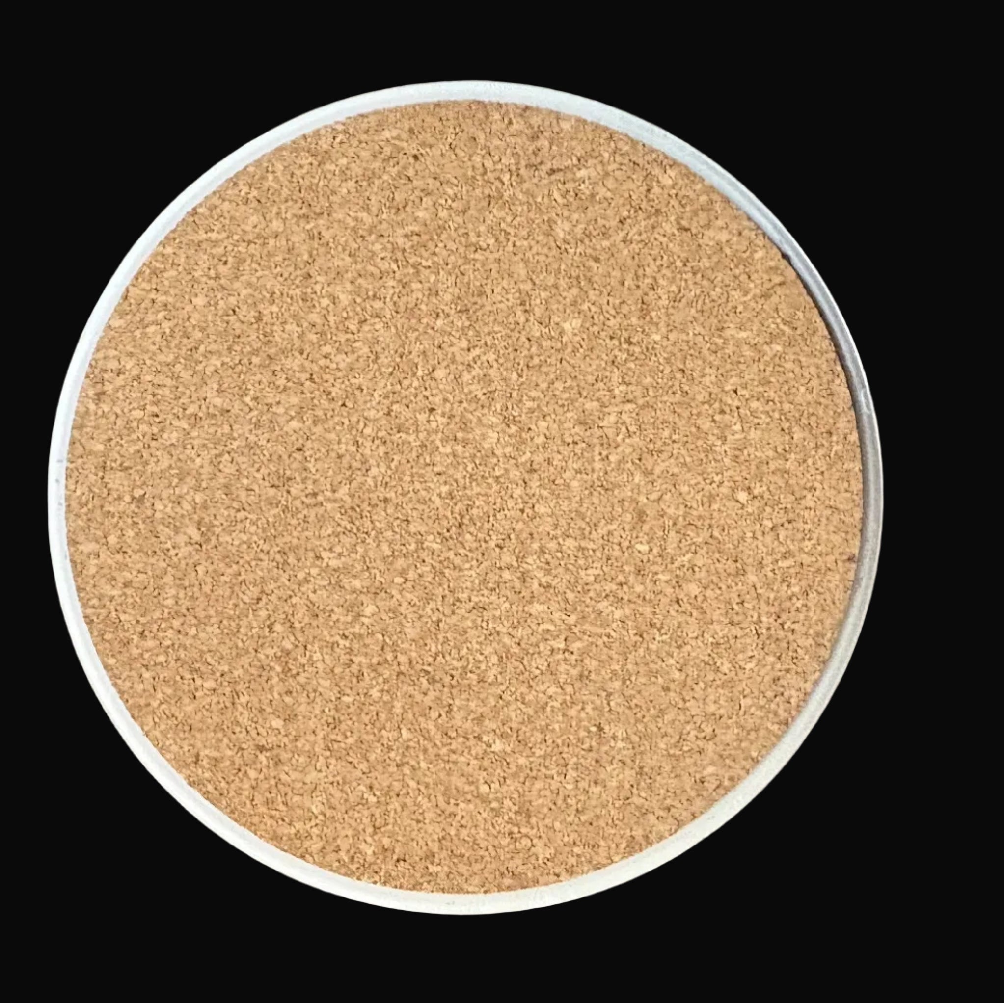 Round cork board on a dark background