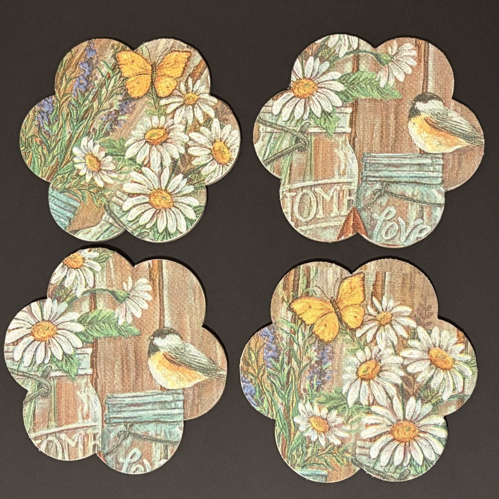 Set of four decorative Magnets with floral and nature-themed designs on a dark background.