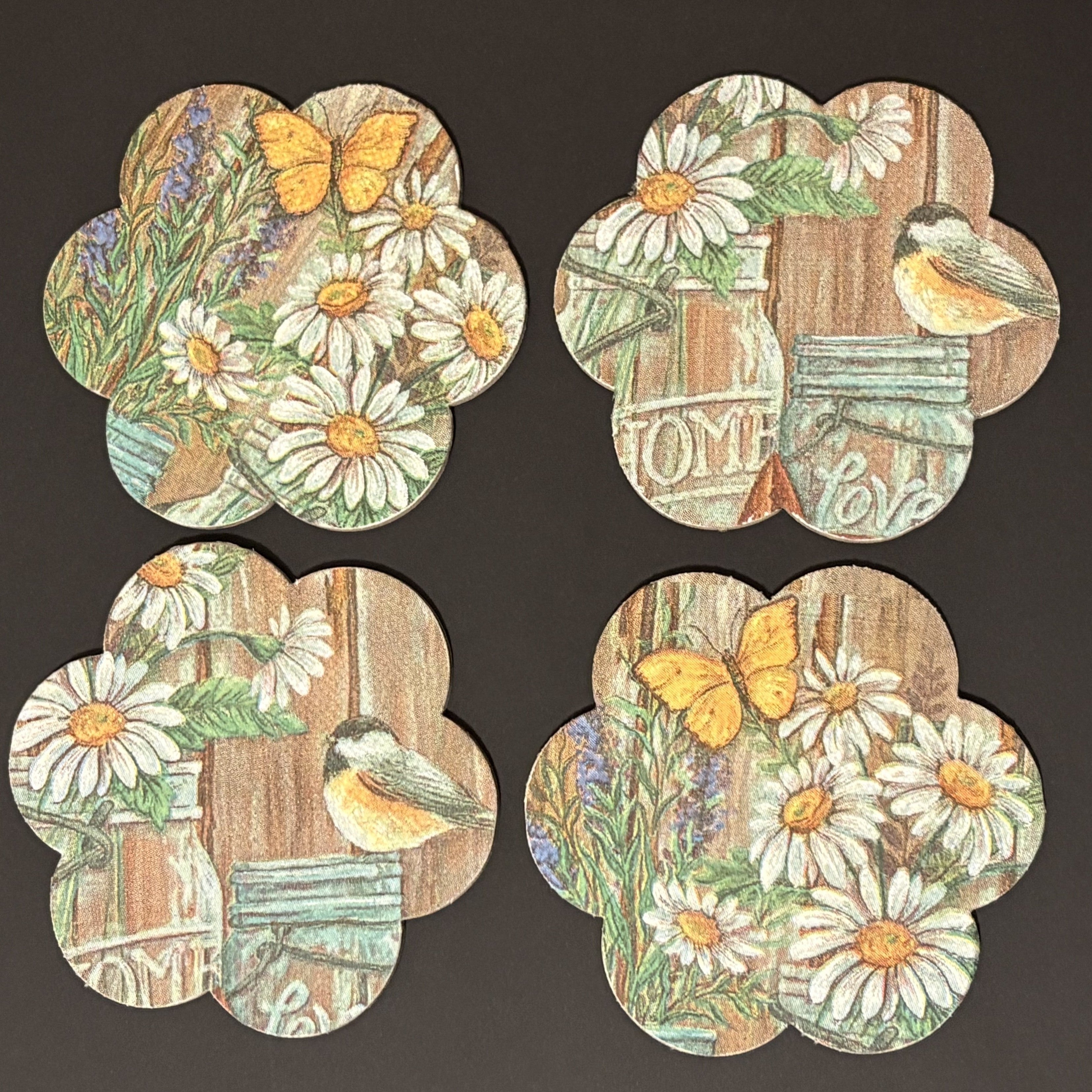 Set of four decorative Magnets with floral and nature-themed designs on a dark background.