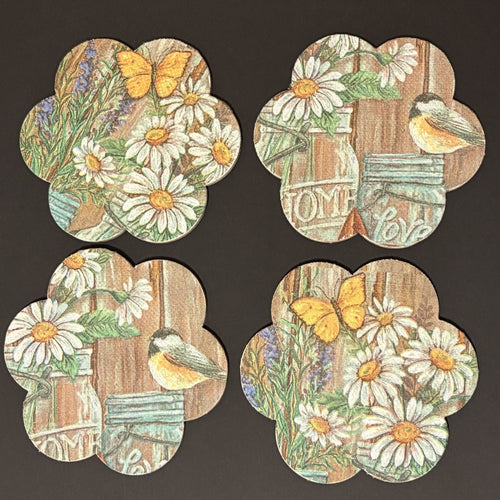 Set of four decorative Magnets with floral and nature-themed designs on a dark background.