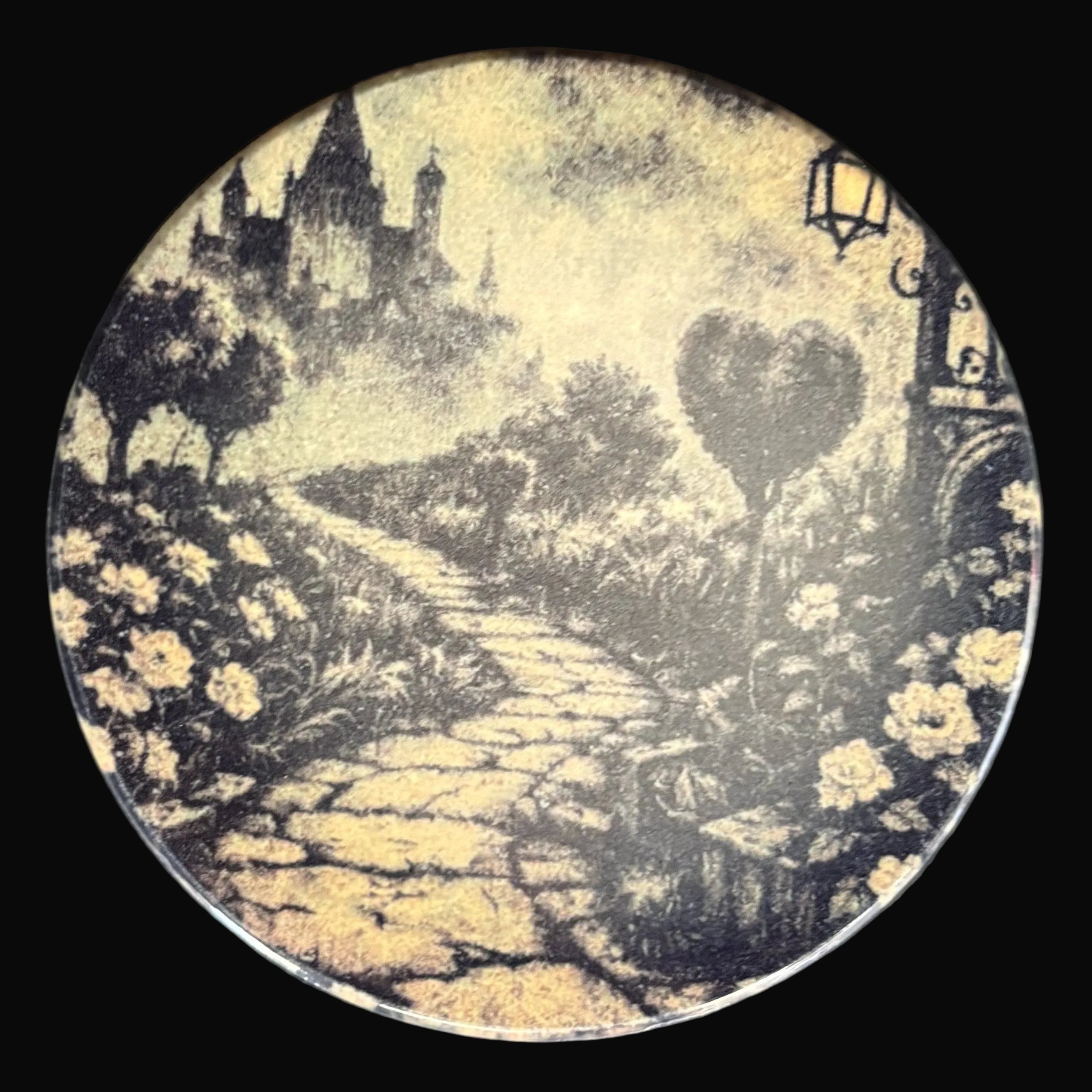 Decorative plate with a romantic scene of a heart-shaped door and pathway on a black background