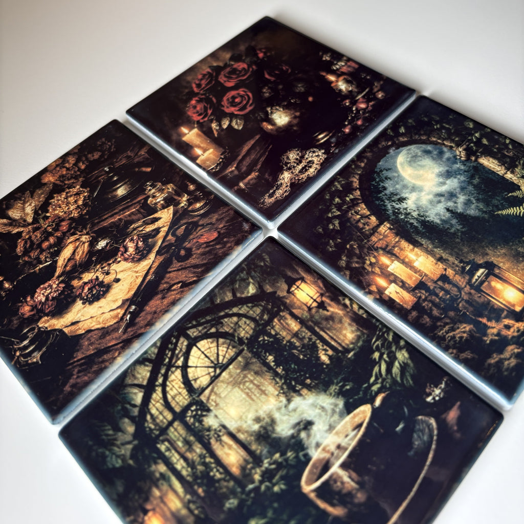 Four square coasters arranged in a grid, each printed with a dark, moody gothic illustration featuring roses, a moonlit scene, a figure in a dark dress, and a greenhouse-like interior.