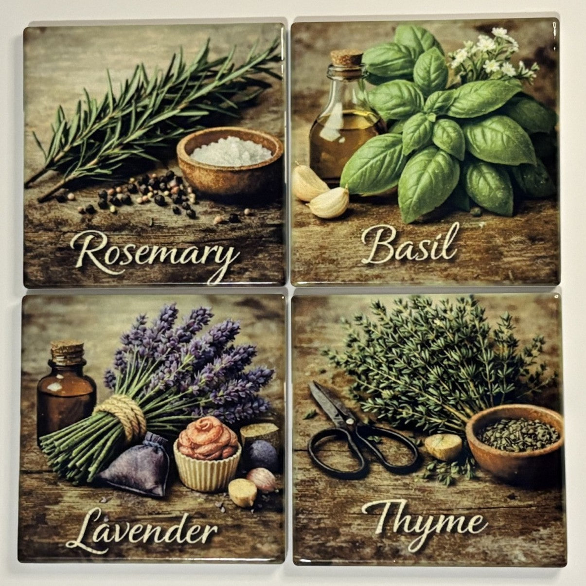 Four square decorative tiles or coasters arranged in a 2x2 grid, each showing a different herb scene with the word name labeled underneath: Rosemary, Basil, Lavender, and Thyme. The designs include fresh herbs, bowls, scissors, and small bottles on a rustic wooden surface.