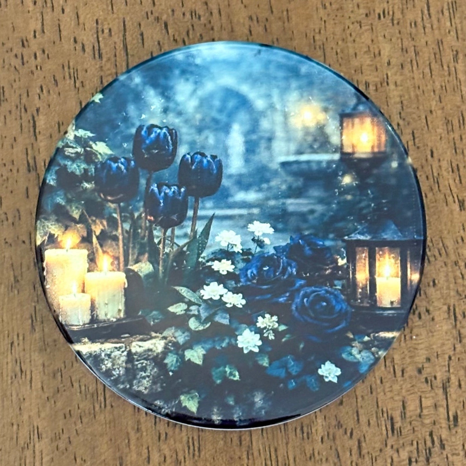 Deep blue florals, candlelit ambience, and ivy‑draped stone create a scene that feels both peaceful and otherworldly.