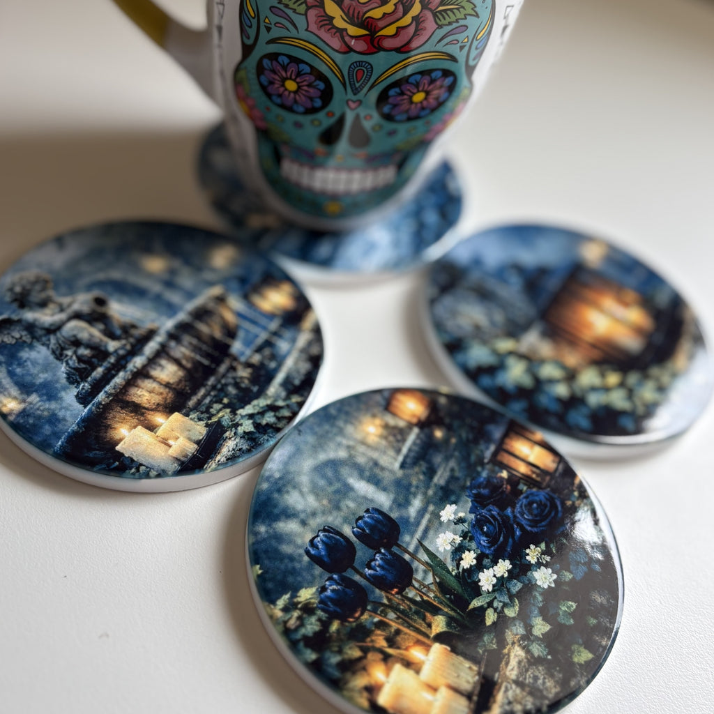 Four round coasters with printed scenic and floral designs are arranged on a light surface, with a colorful mug partially visible behind them.