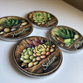Four round succulent-themed coasters arranged on a white surface, each showing a different succulent illustration with the plant name written in script: Haworthia, Echeveria, Aloe Vera, and Sedum.