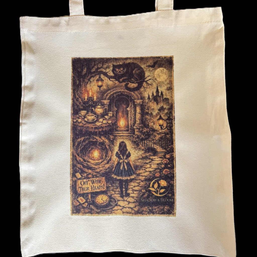 An off-white canvas tote bag featuring a large, detailed graphic print of Wonderland on the front, set against a solid black background.