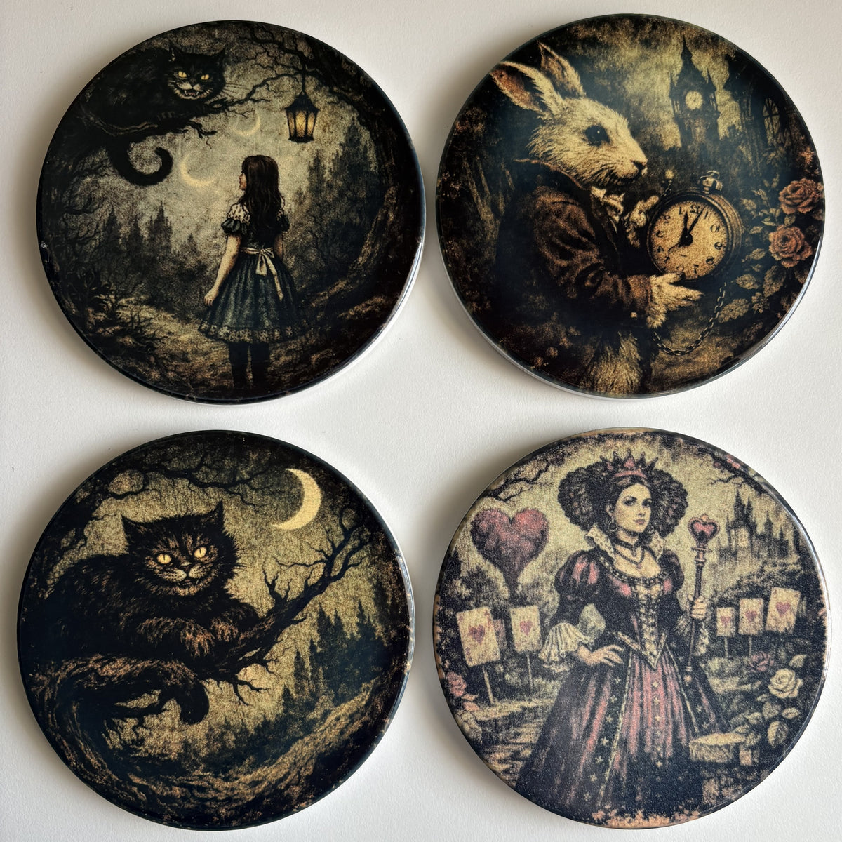 Four round decorative plates with vintage Wonderland artwork, arranged in a 2x2 grid on a light background. 