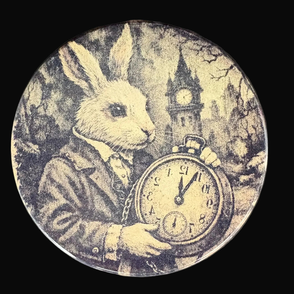 Round coaster with a rabbit holding a vintage clock design on a dark background