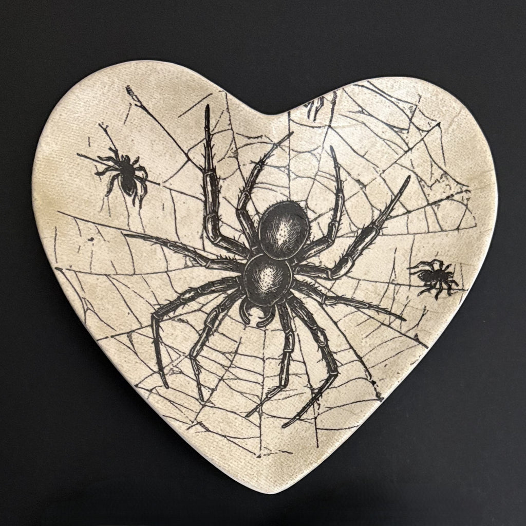 Ceramic trinket tray featuring an intricate gothic spider web illustration