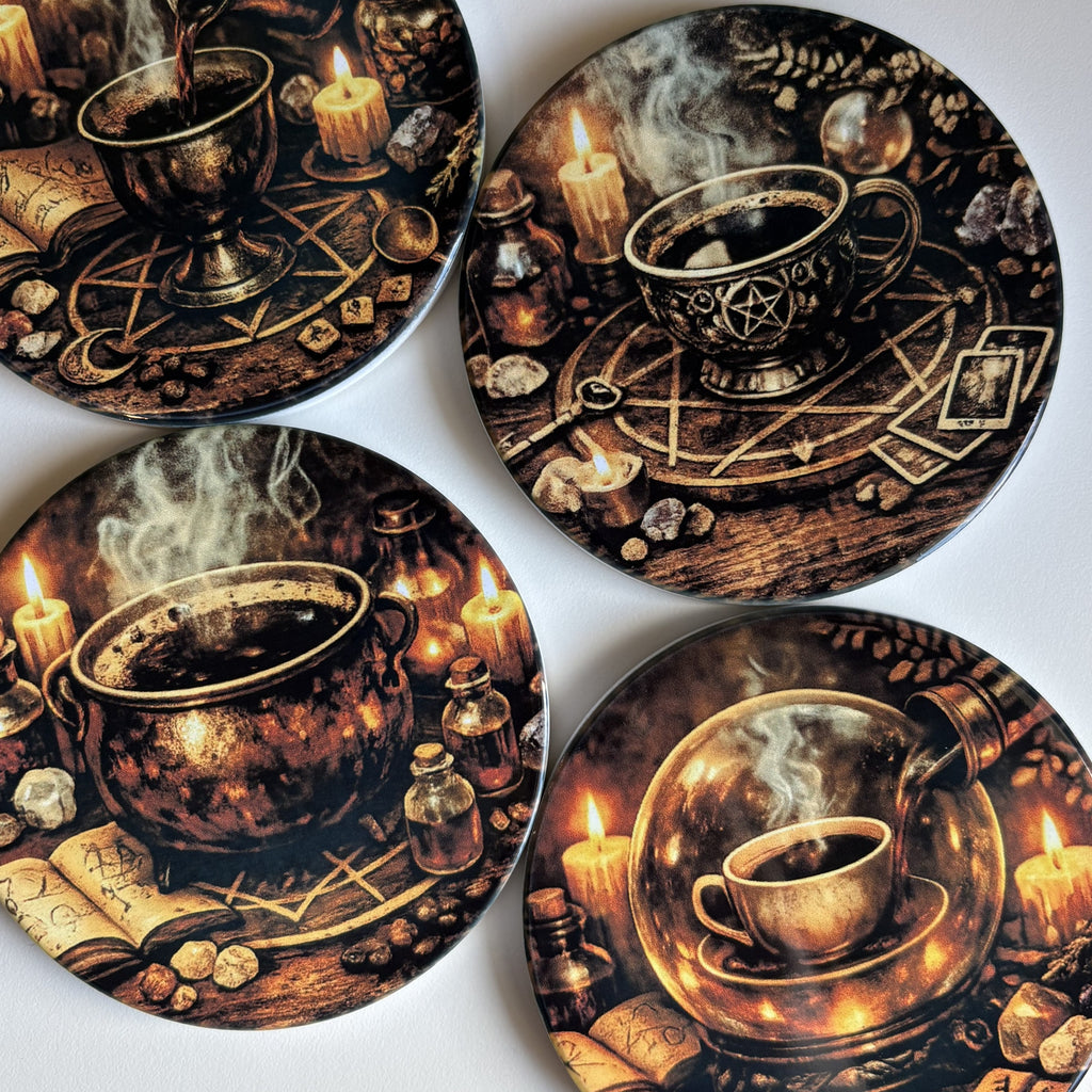 Four round coasters featuring detailed dark fantasy illustrations of mystical cups, cauldrons, candles, crystals, and occult symbols in a warm brown and gold color palette, arranged on a white background.