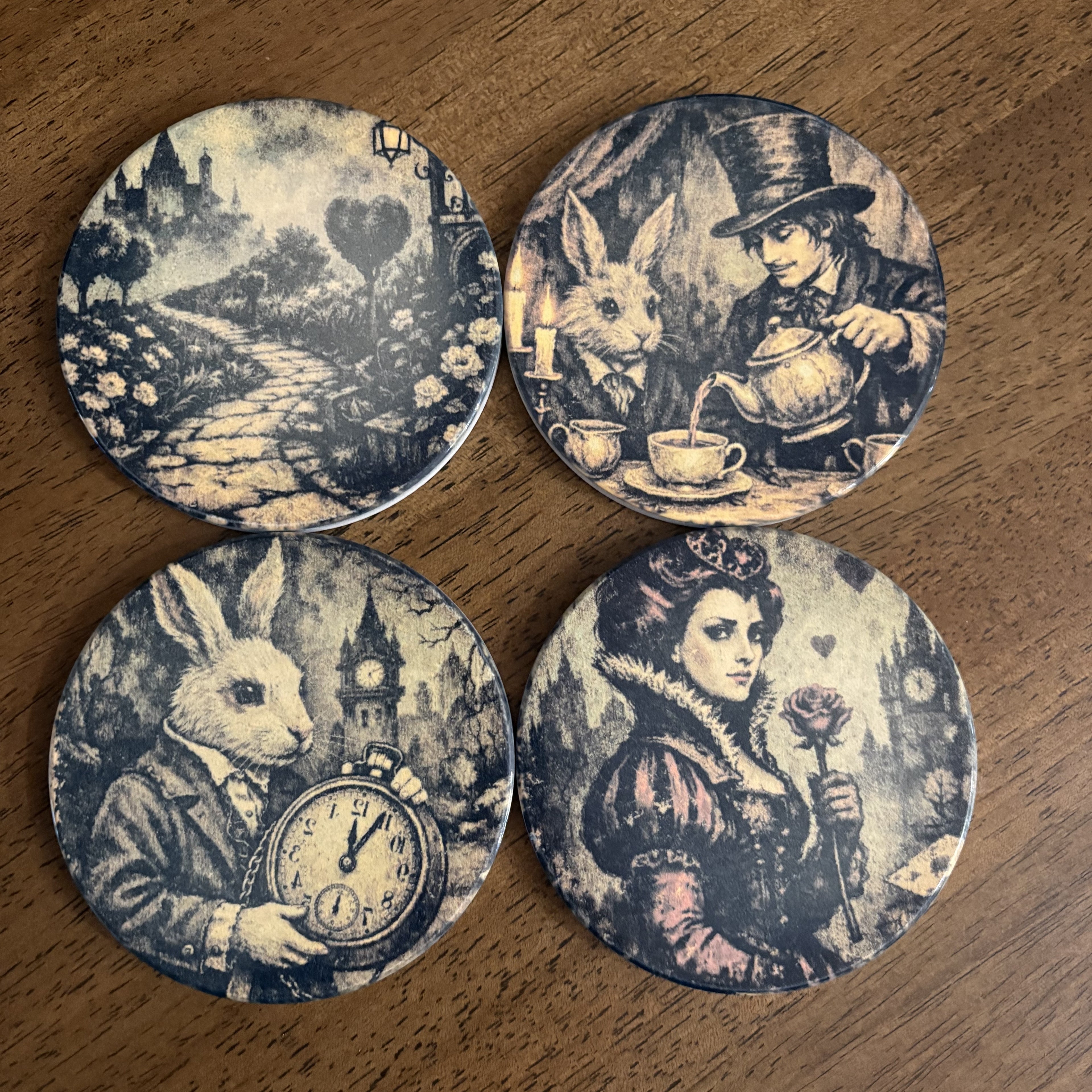 Four round coasters featuring vintage-style Alice in Wonderland illustrations, arranged in a 2x2 grid on a wooden tabletop. The designs include the White Rabbit, the Mad Hatter, the Queen, and a rabbit holding a pocket watch.